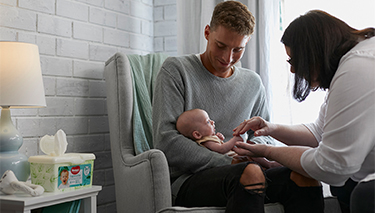 Newborn bub with Midwife Cath and dad