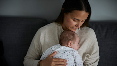 Bub lying on top of mum